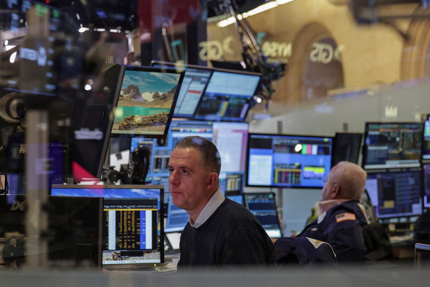 Traders work on the floor at the New York Stock Exchange (NYSE) in New York City