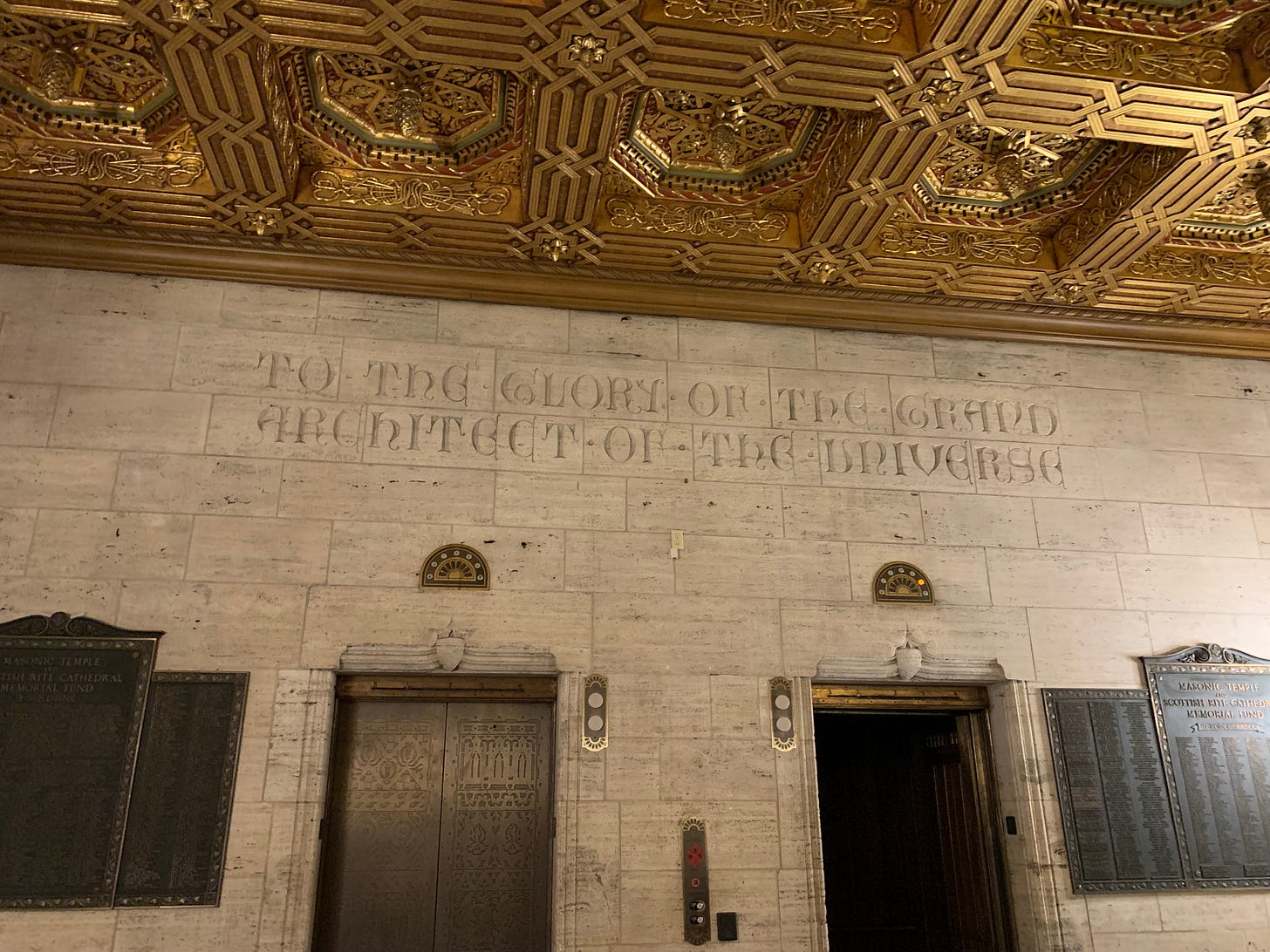 Lobby of Scranton Masonic Temple. Wall says "to the glory of the grand architect of the universe"