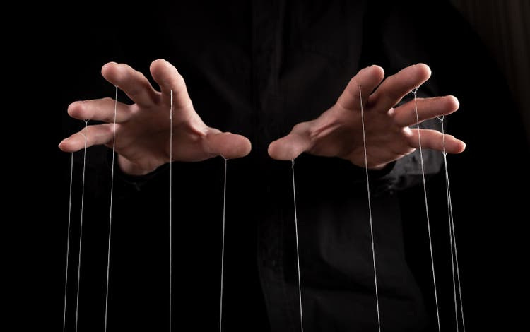 Man hands with strings on fingers. Manipulation, negative influence or addiction concept. Becoming dependent on alcohol, drugs, gambling.