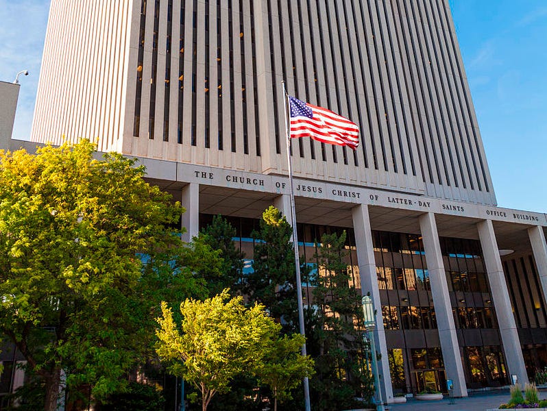 Church Office Building with U.S. flag flying in front Church Office Building with U.S. flag flying in front