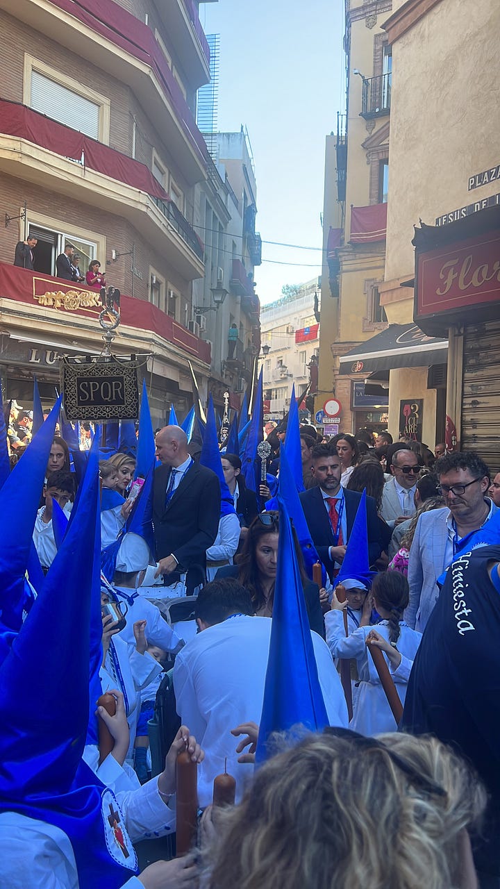 a gallery of pictures showing people in a crowded street as they watch the procession of a brotherhood carrying floats with decorations, flowers and statues