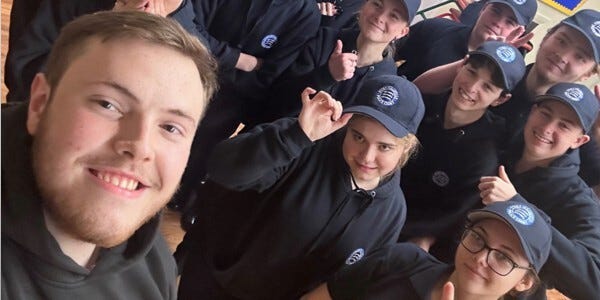 Special Constable Chapman in a selfie photo with several Volunteer Police Cadets