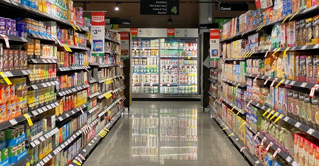 white and red labeled pack on white shelf