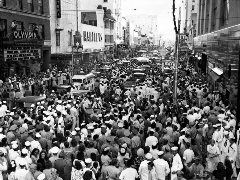 Navy Service Men and Women flood Flagler Street after the news broke of Japan’s surrender. Navy Service Men and Women flood Flagler Street after the news broke of Japan’s surrender.
