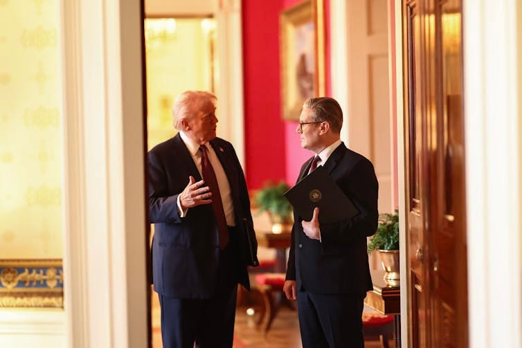 Trump speaks to Starmer while the two are stopped in a doorway inside the White House Trump speaks to Starmer while the two are stopped in a doorway inside the White House