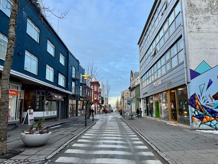 Rainbow Street and single lane road with commercial and residential