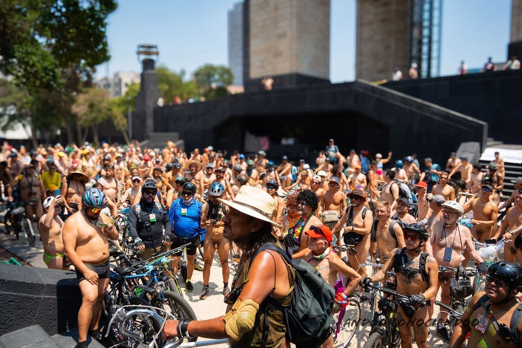 A large crowd of nude and partially nude cyclists gathers with bicycles near the Monumento a la Revolución during the 2026 World Naked Bike Ride in Mexico City. A large crowd of nude and partially nude cyclists gathers with bicycles near the Monumento a la Revolución during the 2026 World Naked Bike Ride in Mexico City.