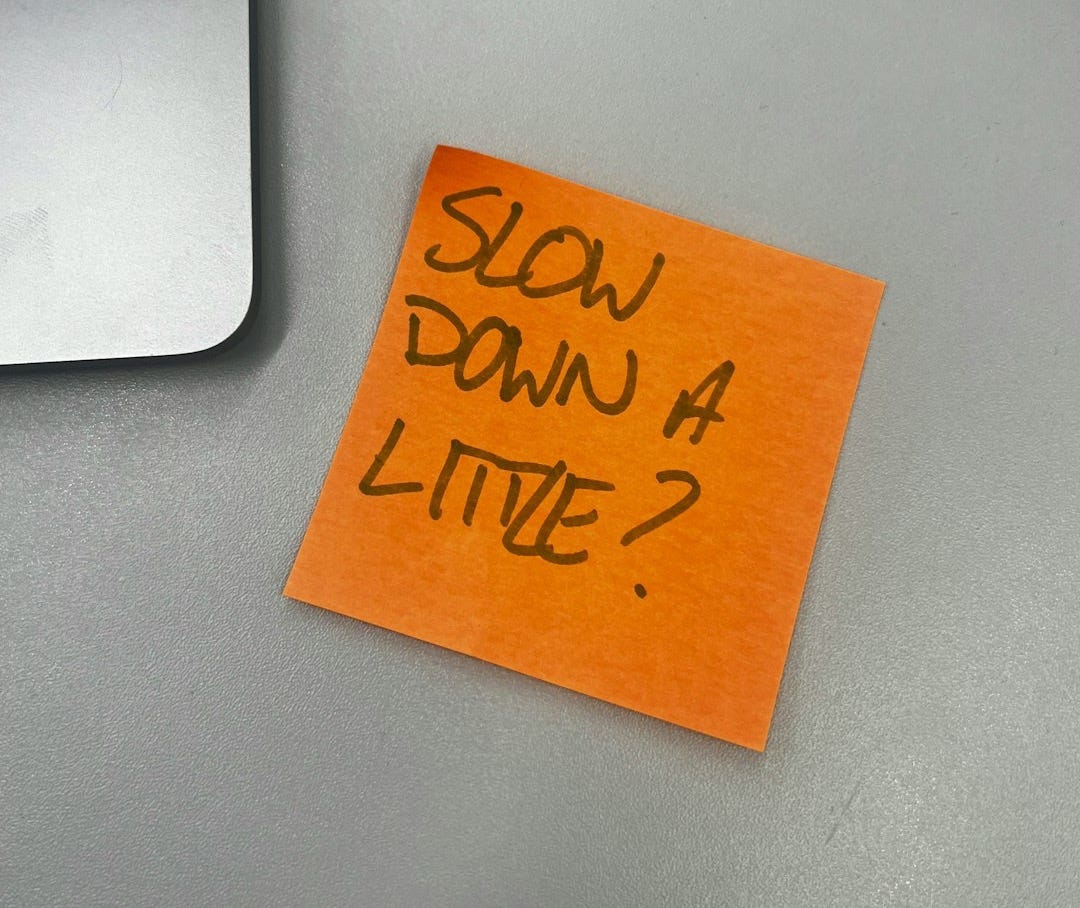 a piece of orange paper with the words slow down 4 little written on it a piece of orange paper with the words slow down 4 little written on it