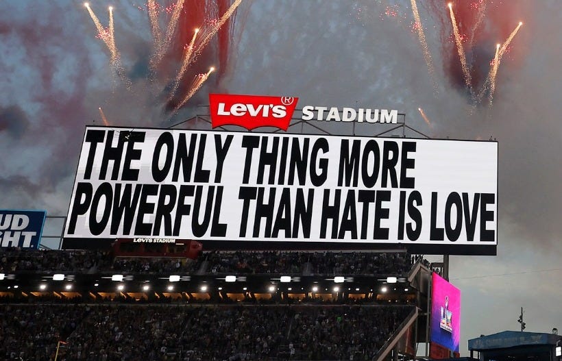 May be an image of fireworks, crowd and text that says 'SCRIPPSINEWS NNEWS SCRIPPS JD ባ LeVI'S STADIUM THEONLY THE ONLY THING MORE POWERFUL THAN TRAFEM THANHATEISLOVE HATEISLO LOVE 番 ア'