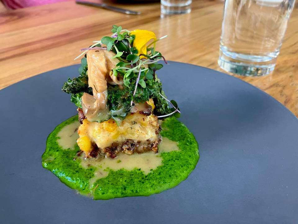 May be an image of poached egg, mushy peas and morel mushroom