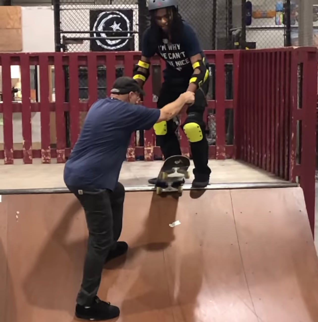 Owner of Modern Skate, George Leichtweis teaching Blind Skater, Coco Atama how to drop in for the first time in his life Owner of Modern Skate, George Leichtweis teaching Blind Skater, Coco Atama how to drop in for the first time in his life