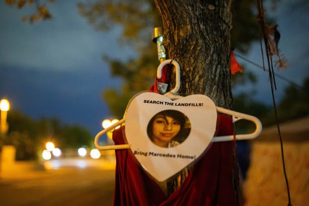 On a tree out front of Camp Marcedes, located next to the Canadian Museum for Human Rights, a photo and red dress signify the loss of Marcedes Myran...