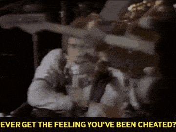 a man playing a guitar with the words " ever get the feeling you 've been cheated " above him