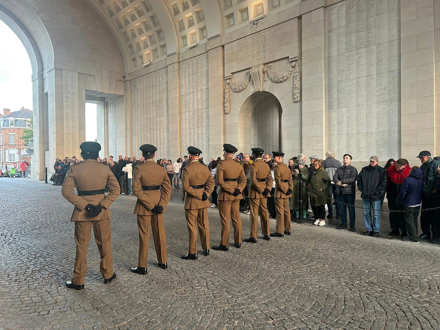 May be an image of 13 people, the Brandenburg Gate and the Tomb of the Unknown Soldier