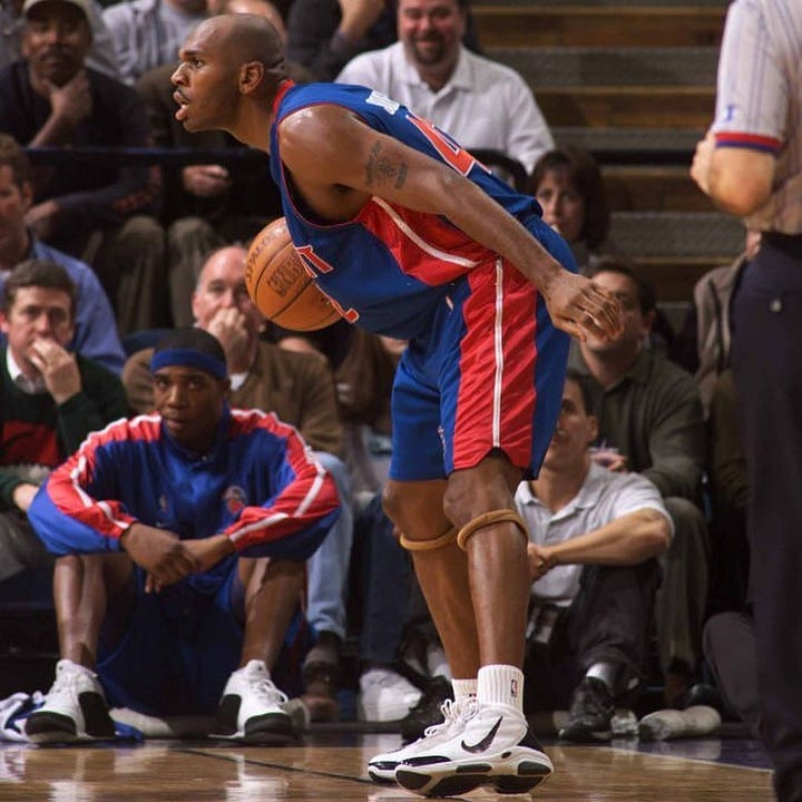 Jerry Stackhouse wearing the AND1 Silky Smooth with a Nike Swoosh drawn on.