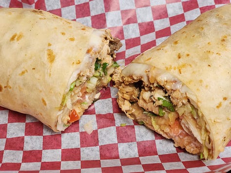 Tacos la Familia chips and salsa trio, chicken burrito, and birria tacos