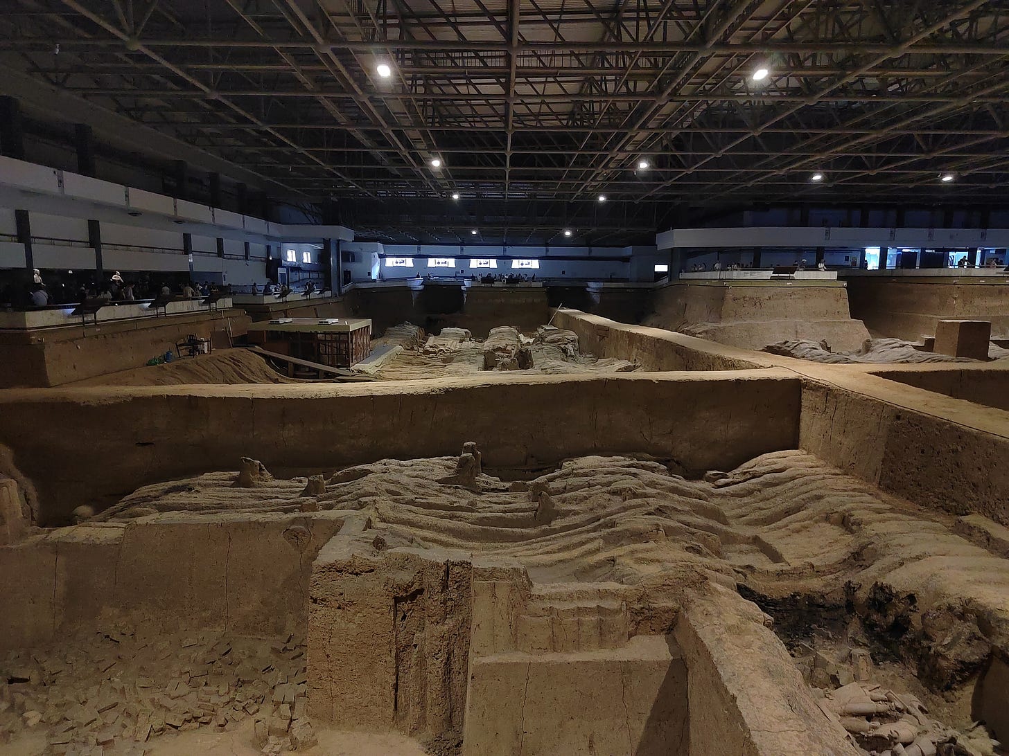 Rows of life size clay soldiers in a pit Rows of life size clay soldiers in a pit