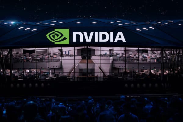 Nvidia’s logo is lit up above a convention space. 