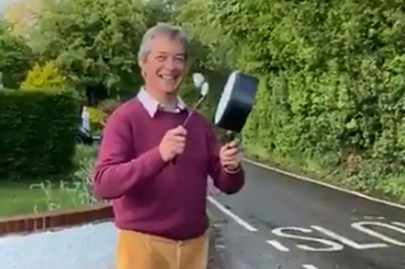 A person holding a frying pan and a flower

Description automatically generated