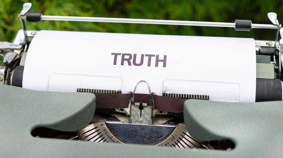 a close up of a typewriter with the word truth on it a close up of a typewriter with the word truth on it