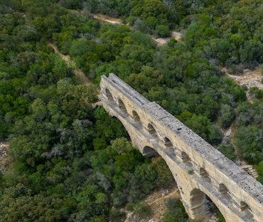 an aerial view of a bridge over a river an aerial view of a bridge over a river