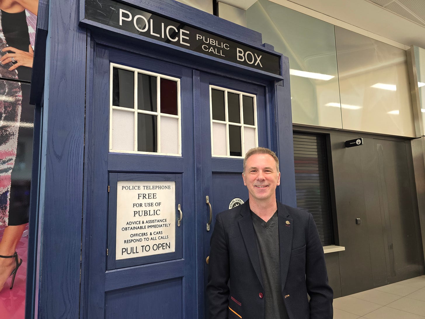 Spencer in front of the TARDIS