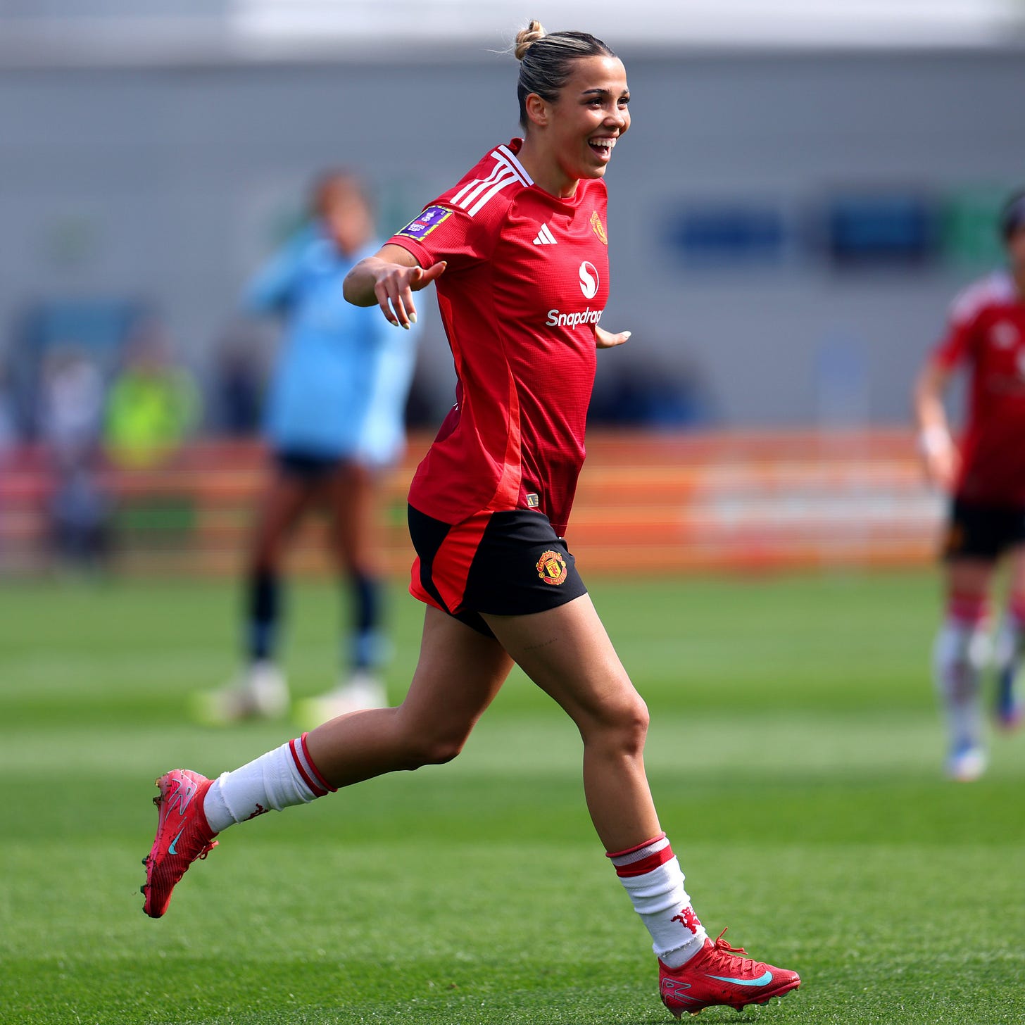 An image of Celin Bizet celebrating scoring for Manchester United