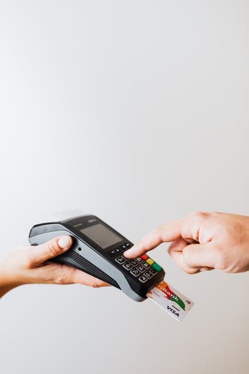 A Person Pressings on the Payment Terminal Keypad