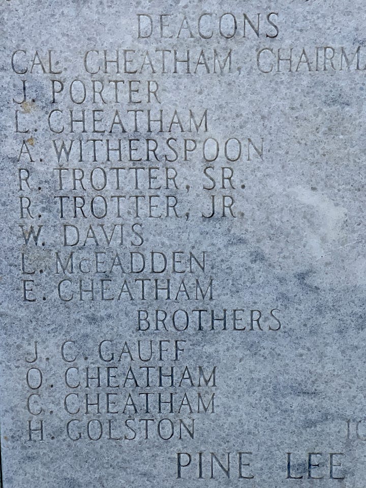 Photos of carved stone markers near the front door of the church.