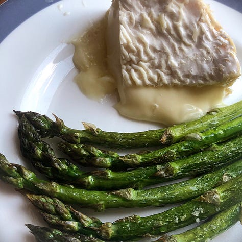 A selection of reasonable food photos, one risotto with tomatoes on a white plate, onei of roasted asparagus and oozing cheese on a white plate, cheese selection on a slate and