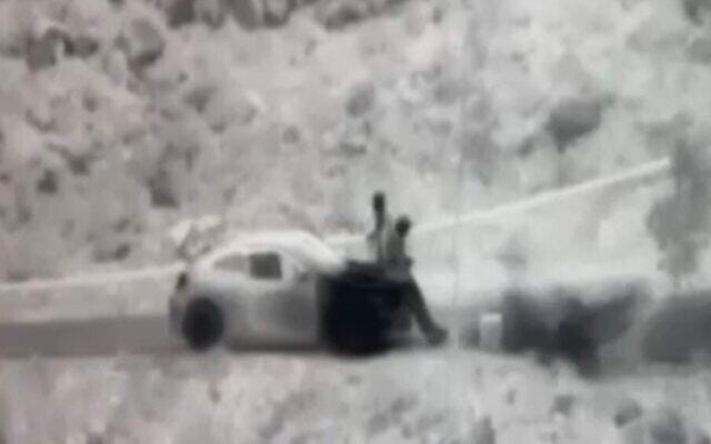 Screen capture from video of a stink bomb, bottom right, exploding next to Hezbollah operatives aiming a laser across the border from Lebanon into Israel. (Channl 12. Used in accordance with Clause 27a of the Copyright Law) Screen capture from video of a stink bomb, bottom right, exploding next to Hezbollah operatives aiming a laser across the border from Lebanon into Israel. (Channl 12. Used in accordance with Clause 27a of the Copyright Law)