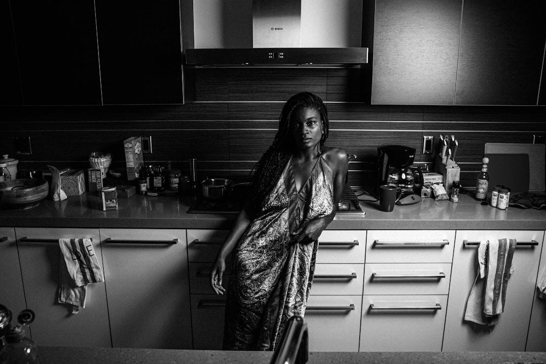 a woman standing in a kitchen