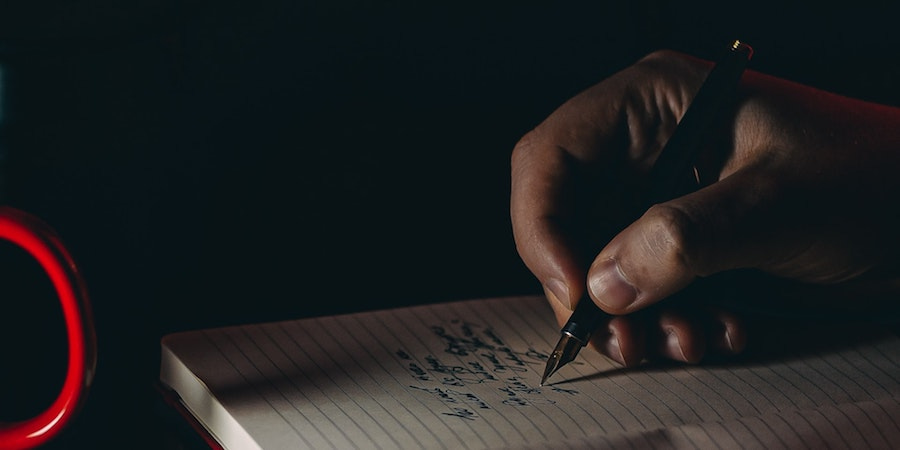 Writing in a notebook