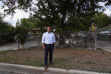 Colin standing in front of a fence Colin standing in front of a fence