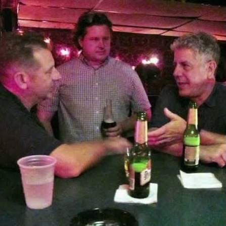 Guys drinking at a bar.
