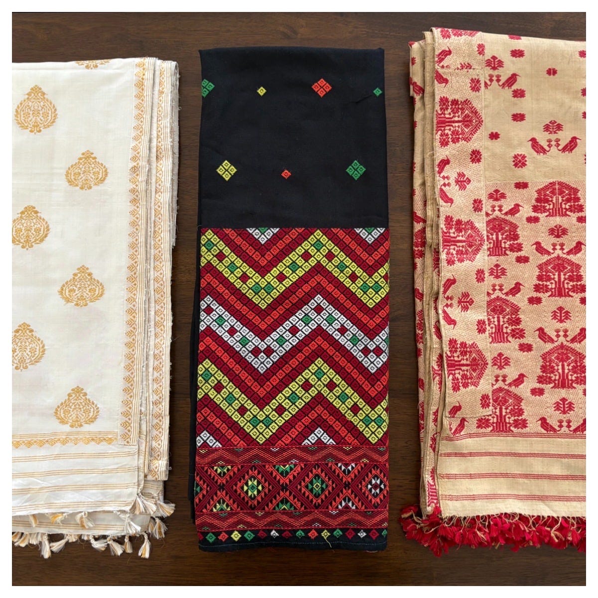 From left to right: a Paat Sador, a Mising Mehkela, and a Muga Sador.