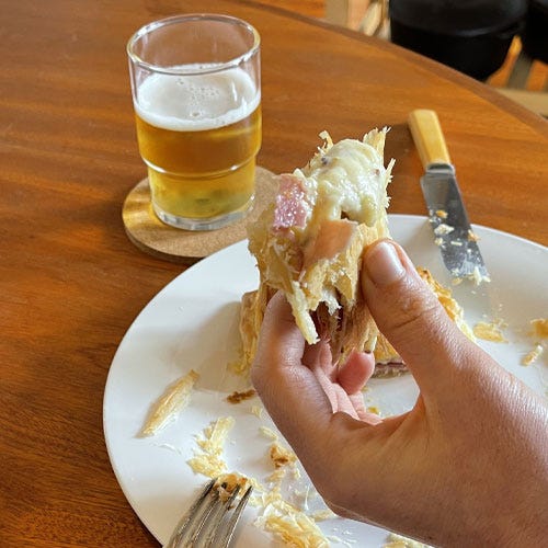 Ham and cheese pie being eaten.