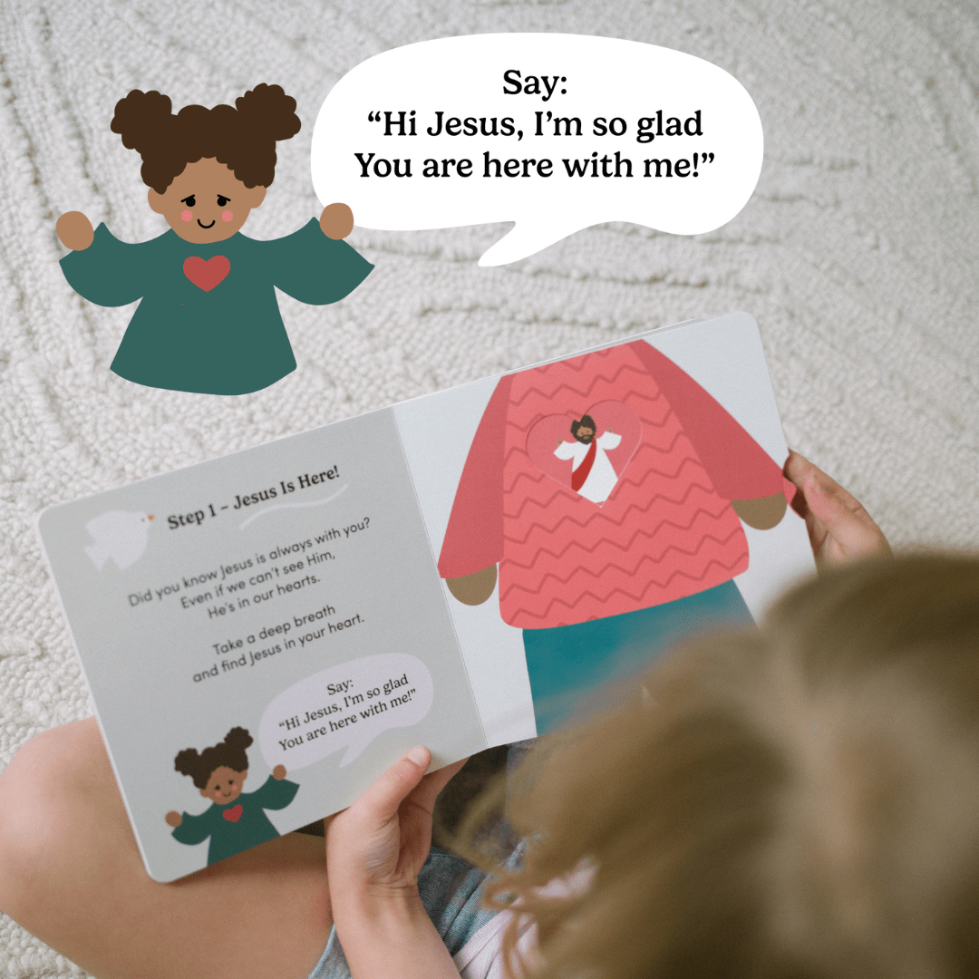 A photo of a child looking at a book. There is an enlarged image from the book of a small girl. She has a speech bubble that says 'Say: "Hi Jesus, I'm so glad You are here with me.'" The page of the book shows an illustration of Jesus inside a heart.
