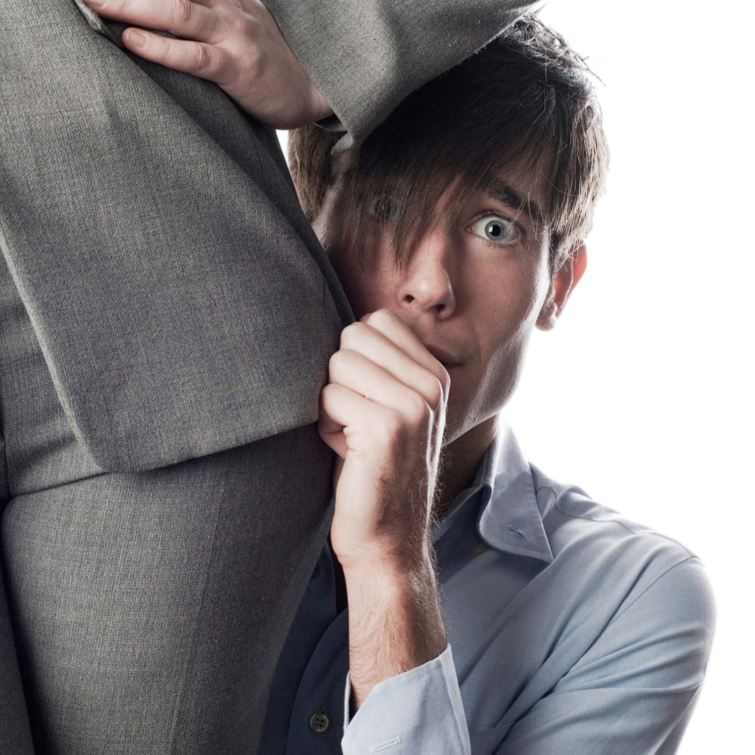Boss cowering behind woman