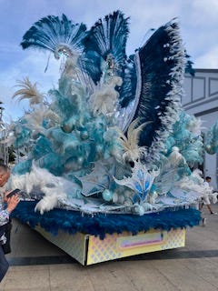 beautiful, feathered floats in shimmering colours that are too big for the warehouse doors