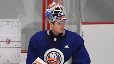 Islanders goaltender Cory Schneider looks on in a