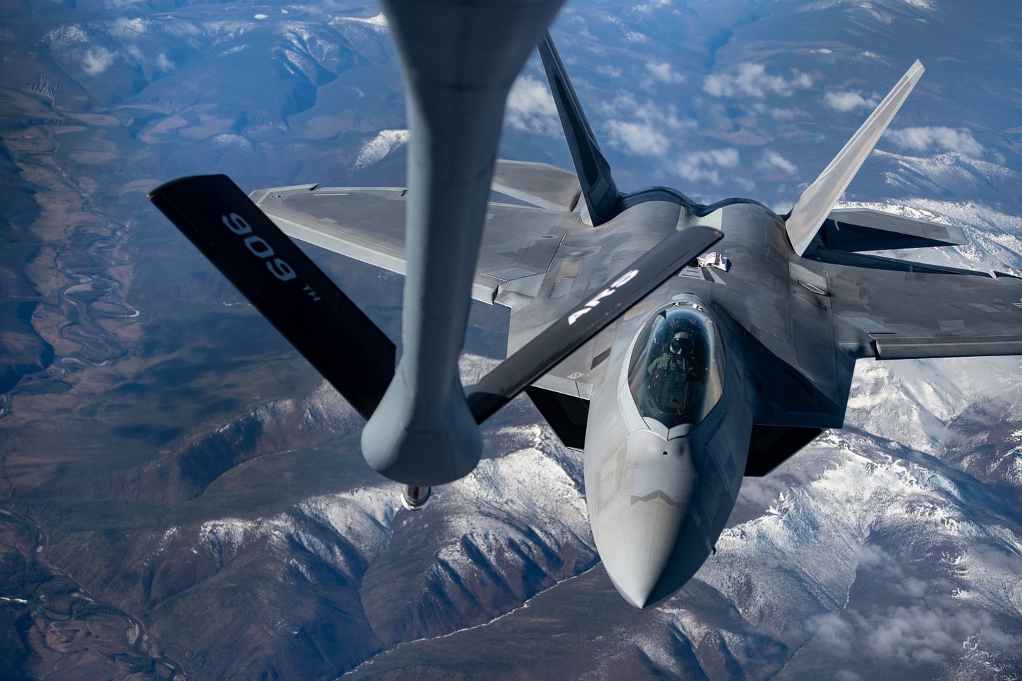 An F-22 is refueled mid-air An F-22 is refueled mid-air