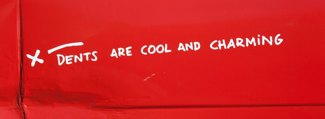 a sticker on the side of a red vehicle