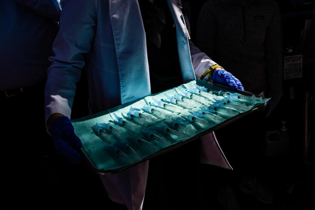 A medical assistant holds a tray of syringes filled with doses of Moderna COVID-19 vaccine at a vaccination site in Los Angeles on Feb. 16, 2021. (Apu Gomes/AFP via Getty Images) A medical assistant holds a tray of syringes filled with doses of Moderna COVID-19 vaccine at a vaccination site in Los Angeles on Feb. 16, 2021. (Apu Gomes/AFP via Getty Images)