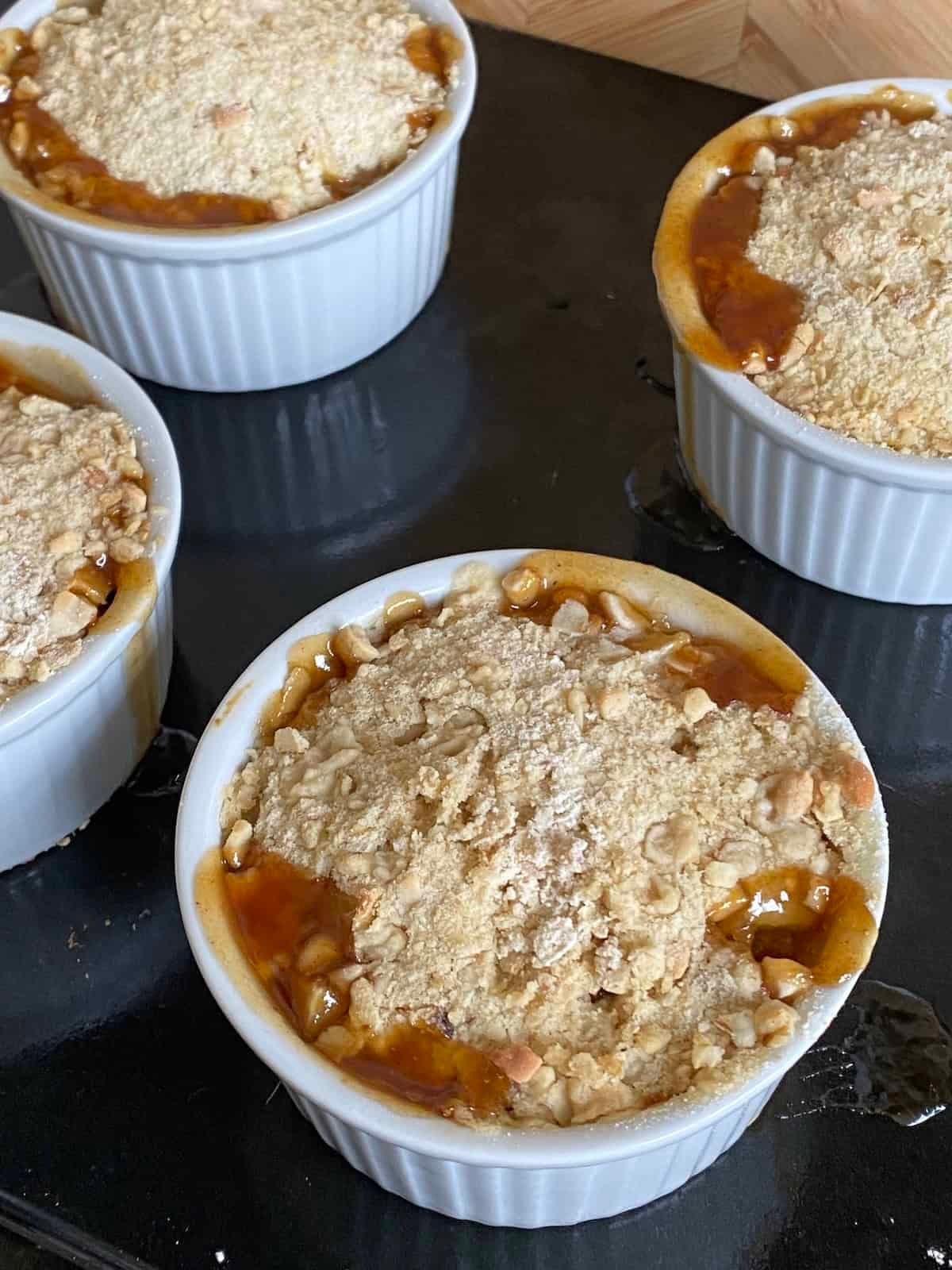 Baked Mincemeat and Pear Crumbles on a baking tray. Baked Mincemeat and Pear Crumbles on a baking tray.