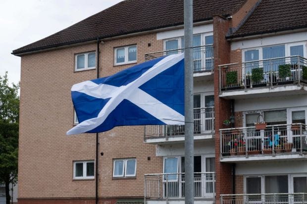 An image collage containing 1 images, Image 1 shows Saltire flag flying from a lamppost in Glasgow