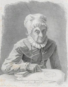 A black and white portrait of an older lady wearing a ruffled bonnet, pointing at a paper. She's holding a magnifying glass. A black and white portrait of an older lady wearing a ruffled bonnet, pointing at a paper. She's holding a magnifying glass.