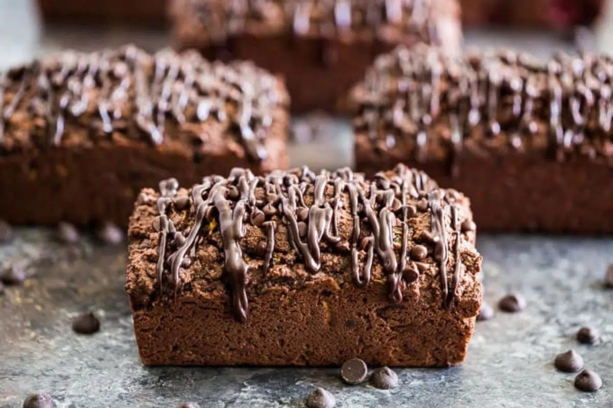 Triple Chocolate Zucchini Bread drizzled with chocolate glaze.