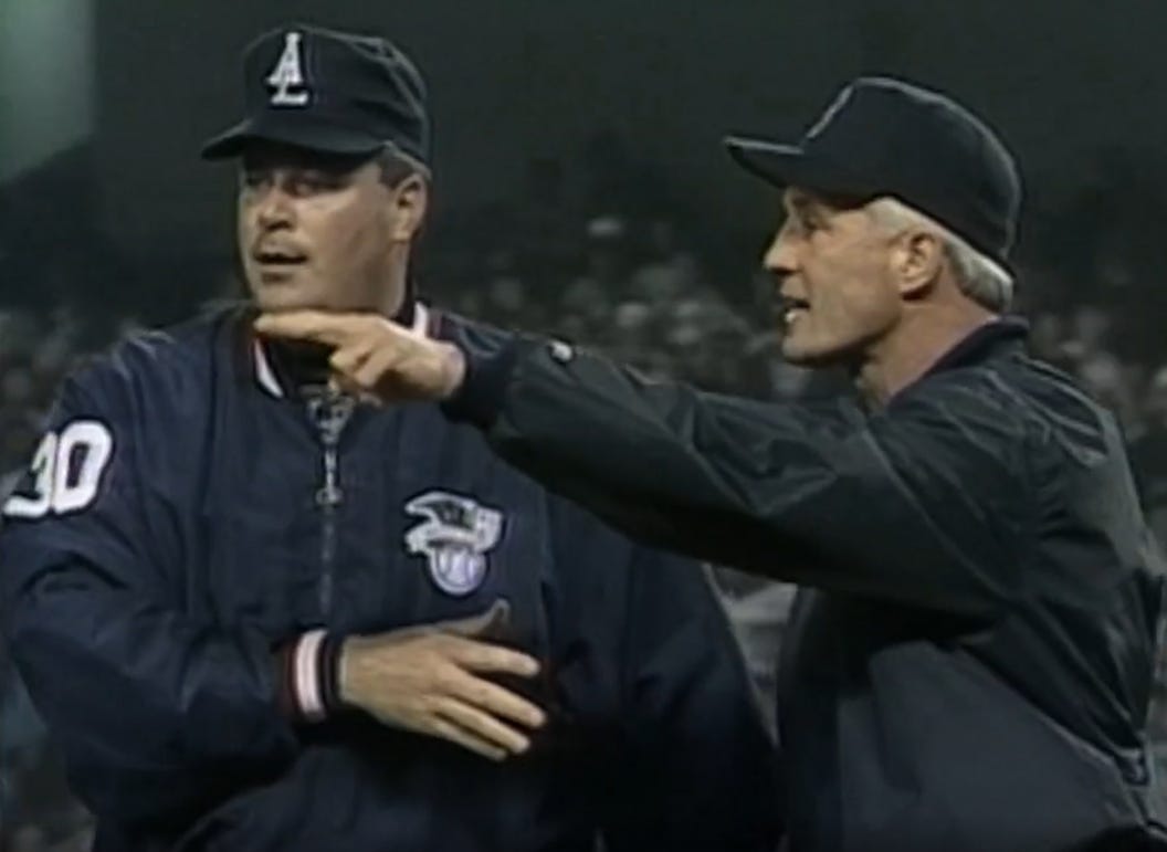 Red Sox manager Butch Hobson and umpire Tim Welke discuss the fan-instigated timeout.