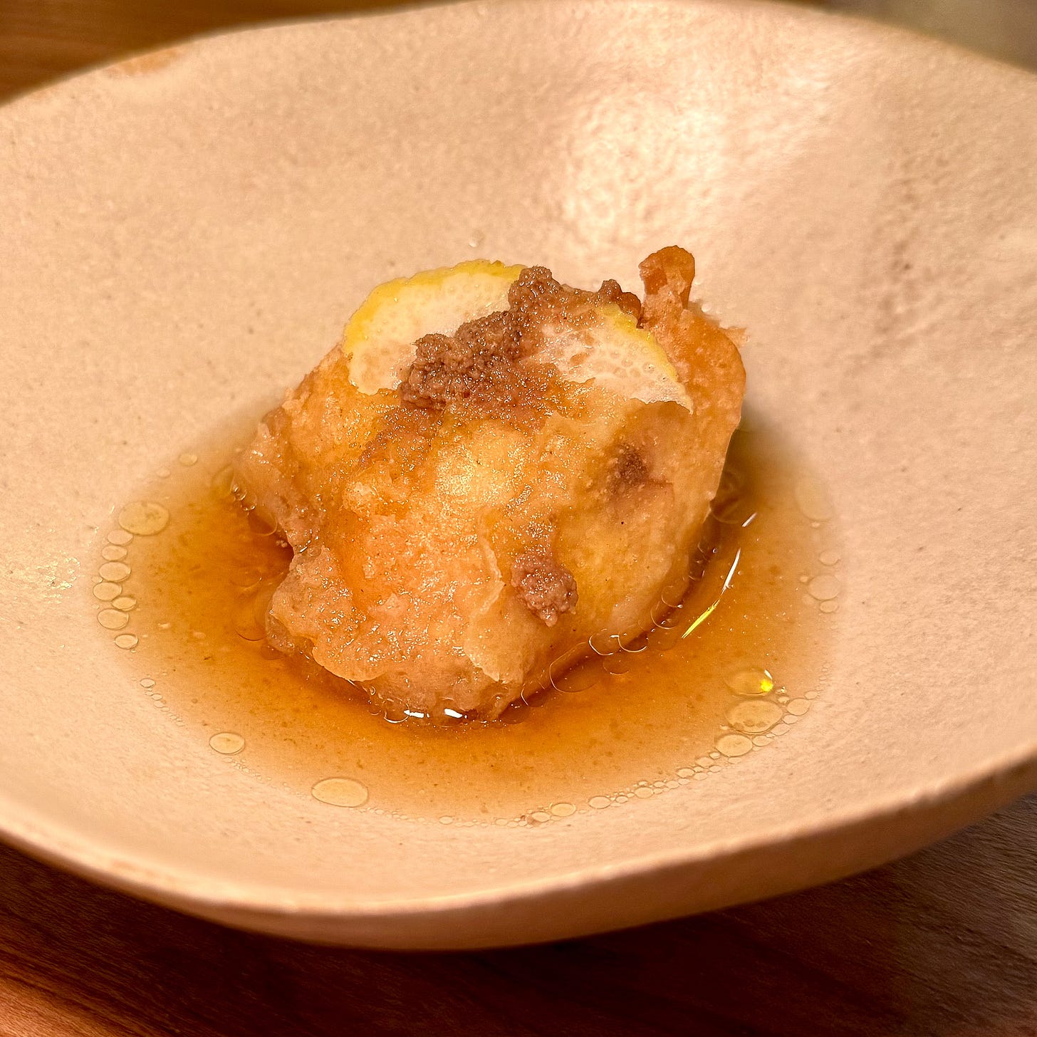 Tempura veal brain in bone marrow consommé at Masaikuta, Paris 11th